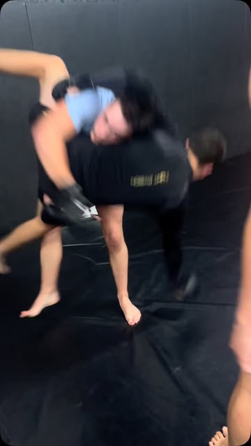 A takedown caught mid motion during a session at North Wales Fight Academy.